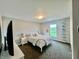 Bedroom with carpet, bed, nightstand, and window with view of the outdoors at 5802 Bentbrook Dr, Bargersville, IN 46106