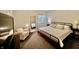 Cozy bedroom with neutral colors, comfortable seating, and natural light at 5802 Bentbrook Dr, Bargersville, IN 46106