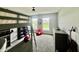 Bedroom features a loft bed, two windows, red beanbag, and gray carpet at 5802 Bentbrook Dr, Bargersville, IN 46106