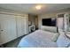 Bedroom featuring dresser with TV, vanity, and closet at 5802 Bentbrook Dr, Bargersville, IN 46106