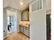 The butler's pantry features granite counters, a tiled backsplash, and shaker style cabinets at 5802 Bentbrook Dr, Bargersville, IN 46106