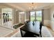 Elegant dining room featuring hardwood floors, a modern chandelier, and large windows at 5802 Bentbrook Dr, Bargersville, IN 46106