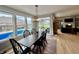 Bright dining area with a view of the pool, a table with six chairs and modern decor at 5802 Bentbrook Dr, Bargersville, IN 46106