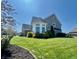 Beautiful two-story home with lush green lawn and manicured landscaping at 5802 Bentbrook Dr, Bargersville, IN 46106