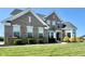 Charming two-story brick home with manicured lawn and well-maintained landscaping at 5802 Bentbrook Dr, Bargersville, IN 46106