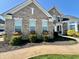 Brick home showcasing an elegant front yard with manicured landscaping and charming flower boxes at 5802 Bentbrook Dr, Bargersville, IN 46106