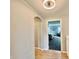 Hallway with wood floors, an archway and view into the main bedroom at 5802 Bentbrook Dr, Bargersville, IN 46106