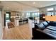Spacious kitchen and living space with an island, seating, pendant lighting and modern decor at 5802 Bentbrook Dr, Bargersville, IN 46106