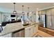 Stylish kitchen with island, stainless steel appliances, and view to the living area at 5802 Bentbrook Dr, Bargersville, IN 46106