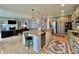 Bright, open kitchen with island, stainless steel appliances, and seamless flow to the living room at 5802 Bentbrook Dr, Bargersville, IN 46106
