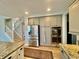 Open kitchen with stainless steel appliances and easy access to the staircase at 5802 Bentbrook Dr, Bargersville, IN 46106
