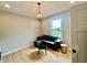 Cozy living room with hardwood floors, modern light fixture and comfortable seating at 5802 Bentbrook Dr, Bargersville, IN 46106