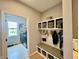 Organized mud room with built-in bench, storage cubbies, and convenient access to the laundry room at 5802 Bentbrook Dr, Bargersville, IN 46106