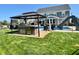 A detailed view of the backyard kitchen with a built-in grill and patio, ideal for outdoor cooking and Gathering fun at 5802 Bentbrook Dr, Bargersville, IN 46106