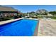 A sparkling swimming pool surrounded by lush landscaping and outdoor seating provides a perfect spot for relaxation and entertainment at 5802 Bentbrook Dr, Bargersville, IN 46106