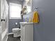 Updated bathroom featuring white vanity, tile floor, and shower/tub combo at 6164 Evanston Ave, Indianapolis, IN 46220
