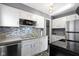 Bright kitchen with modern appliances, sleek backsplash, and plenty of storage at 6164 Evanston Ave, Indianapolis, IN 46220