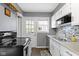 Well-equipped kitchen features stainless steel appliances and ample counter space at 6164 Evanston Ave, Indianapolis, IN 46220