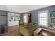 Cozy living room with hardwood floors, built-in bookcase, and comfortable seating at 6164 Evanston Ave, Indianapolis, IN 46220