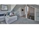 Cozy bonus room with vaulted ceilings and view of stairway at 6173 Rosslyn Ave, Indianapolis, IN 46220