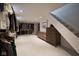 Spacious closet with custom shelving, storage, and drawers, and adjacent stairs at 6173 Rosslyn Ave, Indianapolis, IN 46220