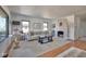 Bright living room featuring a decorative fireplace, large windows, and stylish decor at 6173 Rosslyn Ave, Indianapolis, IN 46220