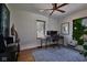 Home office featuring a large window, desk and chair, and hardwood floors at 6173 Rosslyn Ave, Indianapolis, IN 46220