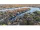 Lush aerial view showcases lakefront homes and docks in a densely wooded area, providing privacy at 7014 Eagle Dr, Nineveh, IN 46164