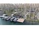 Aerial view of a waterfront property with boat dock and lush greenery at 7014 Eagle Dr, Nineveh, IN 46164
