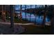 Charming lakeside property with inviting outdoor lights and a serene waterfront view, creating a perfect retreat at 7014 Eagle Dr, Nineveh, IN 46164