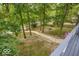 Backyard view with walkway to lake and outdoor fireplace area at 7014 Eagle Dr, Nineveh, IN 46164