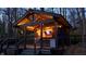 Exterior angle of the lakeside bar showing the construction, outdoor lighting, and neighborhood at 7014 Eagle Dr, Nineveh, IN 46164