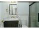 This bathroom features a modern vanity with quartz counters, tile flooring, and updated fixtures at 7014 Eagle Dr, Nineveh, IN 46164