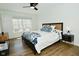Bright bedroom featuring a bed, dresser, and large window with natural light at 7014 Eagle Dr, Nineveh, IN 46164
