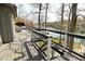 Open deck with black metal and wood railing overlooking a lake at 7014 Eagle Dr, Nineveh, IN 46164