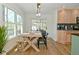 Bright dining room with wood table, bench, and views of the outside at 7014 Eagle Dr, Nineveh, IN 46164