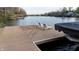Relaxing lakeside dock with comfortable lounge chairs, offering a perfect spot to enjoy scenic views and water activities at 7014 Eagle Dr, Nineveh, IN 46164