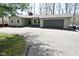 Charming gray single-story home with attached garage and a paved driveway at 7014 Eagle Dr, Nineveh, IN 46164