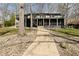 Beautiful two-story home features a large deck, well-maintained landscaping, and a welcoming pathway to the front door at 7014 Eagle Dr, Nineveh, IN 46164
