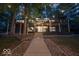 Inviting two-story home with a spacious deck, manicured landscaping, and a stone pathway leading to the entrance at 7014 Eagle Dr, Nineveh, IN 46164