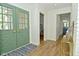Bright foyer with decorative doors, wood floors and views of rooms beyond at 7014 Eagle Dr, Nineveh, IN 46164