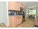 Modern kitchen featuring wood cabinets, stainless steel appliances, and a dining area at 7014 Eagle Dr, Nineveh, IN 46164