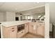 Basement kitchenette featuring quartz countertops, stainless microwave, and wood cabinets at 7014 Eagle Dr, Nineveh, IN 46164