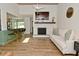 Open living room featuring a fireplace, comfortable seating, and connected kitchen area at 7014 Eagle Dr, Nineveh, IN 46164