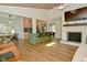 Open concept living area with wood ceiling, fireplace, and views of the kitchen at 7014 Eagle Dr, Nineveh, IN 46164