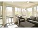 Relaxing sunroom featuring natural light, comfortable seating, and scenic outdoor views at 7014 Eagle Dr, Nineveh, IN 46164