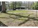 Spacious, green front lawn, bordered by trees, leading up to a gray house with an attached garage at 7014 Eagle Dr, Nineveh, IN 46164