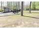 Spacious yard with a boat trailer parked on a gravel area near mature trees at 7014 Eagle Dr, Nineveh, IN 46164