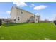 Spacious backyard surrounded by black metal fencing offering privacy at 7128 English Oak Dr, McCordsville, IN 46055
