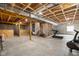An unfinished basement offers exposed beams, concrete flooring, and ample space at 7128 English Oak Dr, McCordsville, IN 46055